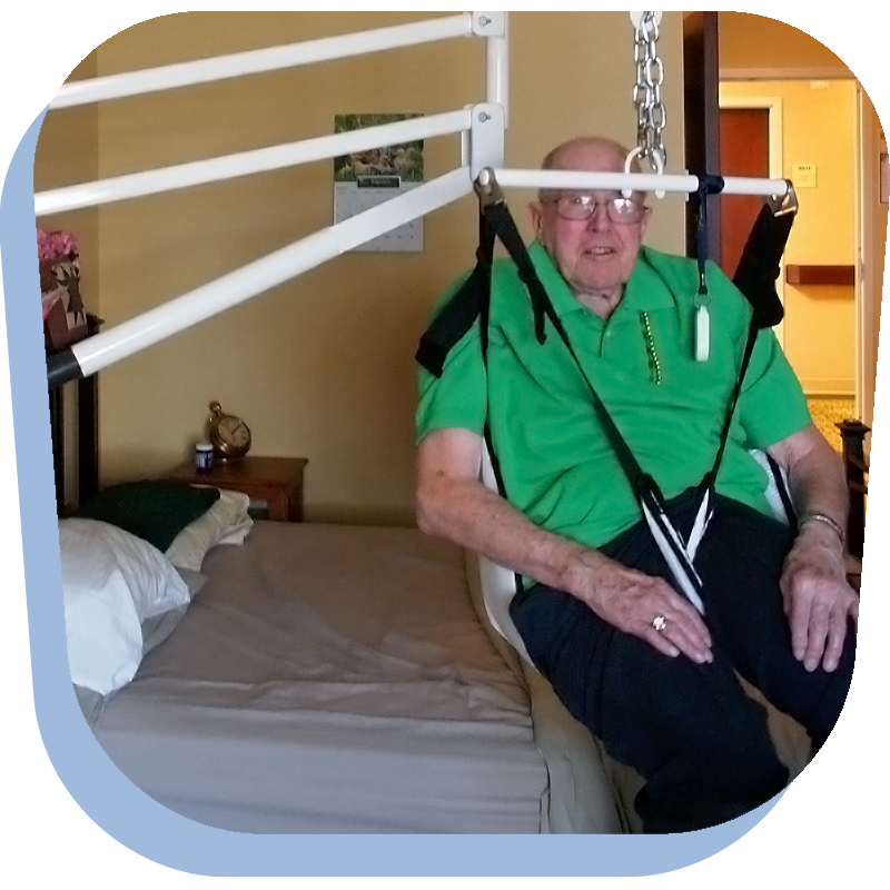 An elderly disabled gentleman uses a LifeLyfts Residential Lift to move around in his bedroom.