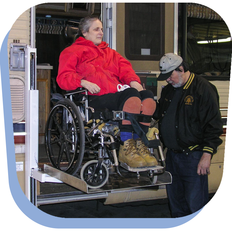 (A disabled woman uses a LifeLyts RV Lift to get into an RV.